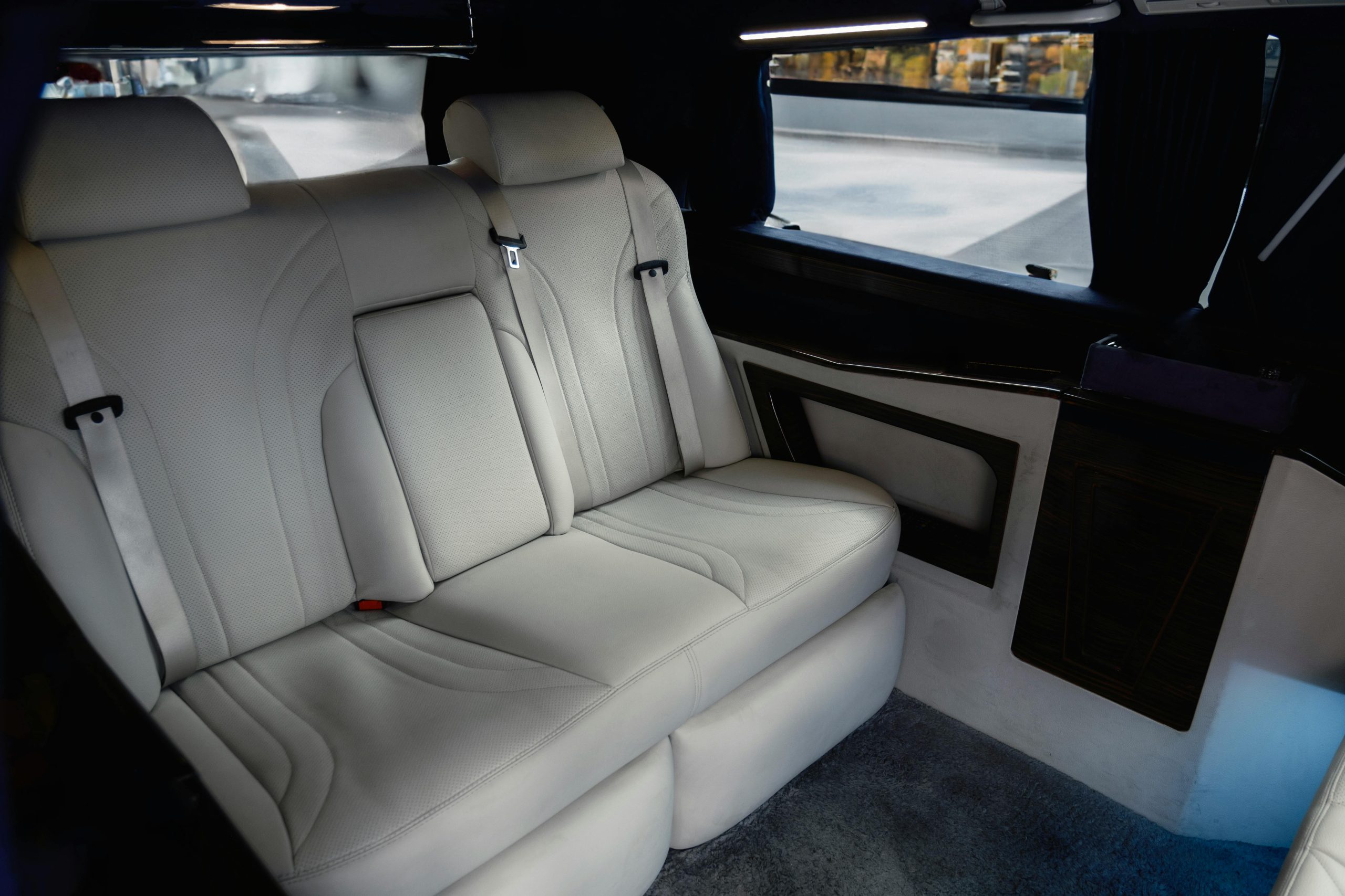 Explore the spacious and luxurious interior of a Mercedes-Benz V-Class, featuring premium white leather seats.